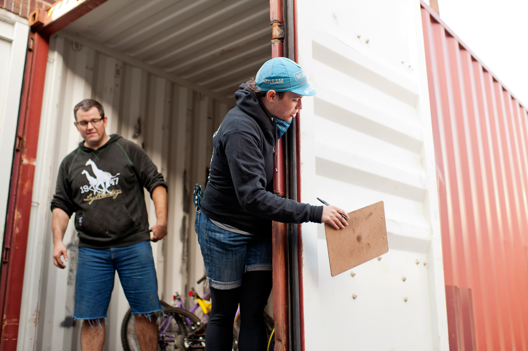 volunteers loading container with used bikes for Bikes Not Bombs in Boston