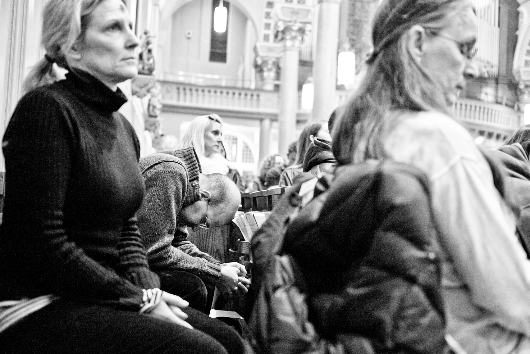 man praying in St. Cecilia Parish Boston on Ash Wednesday