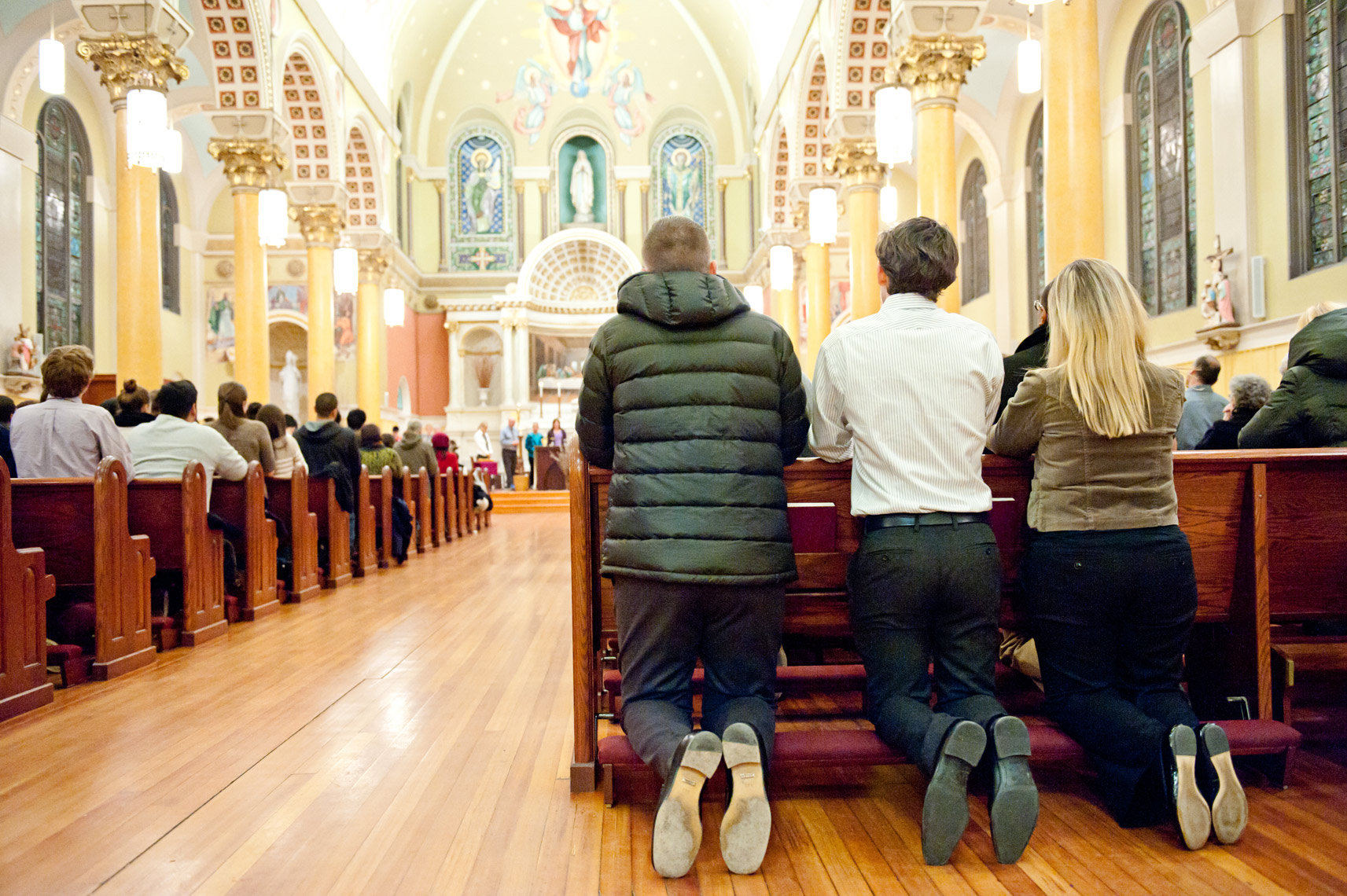 people praying at St. Cecilia Parish in Boston on Ash Wednesday