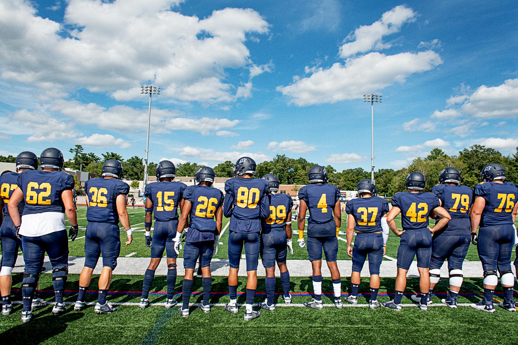 on the sidelines at at college football game Merrimack College Massachusetts