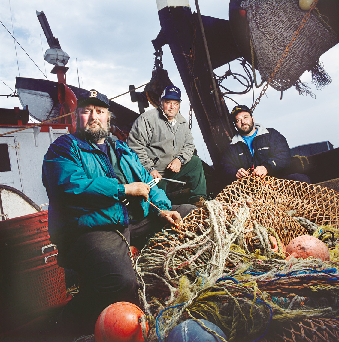 Gloucester fisherman fixing their nets for Boston Magazine